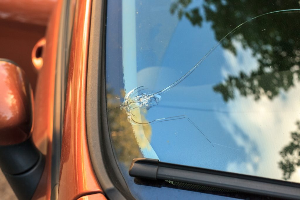 Broken car windshield glass from stone
